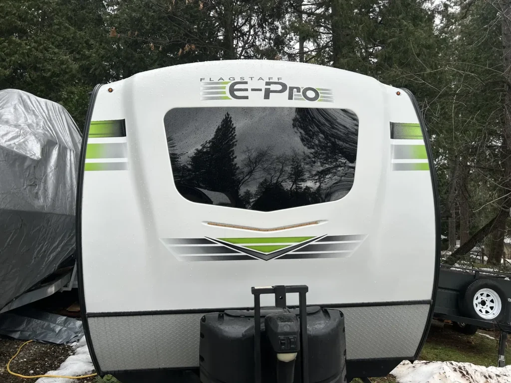 Compact travel trailer with a new-looking front window