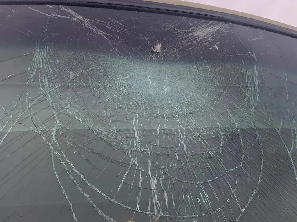 Badly cracked motorhome windshield before replacement