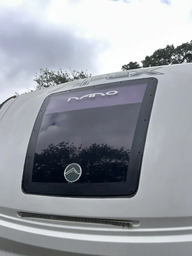 Small fiberglass travel trailer front window glass