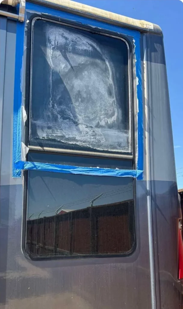 Fogged dual-pane RV side window before repair