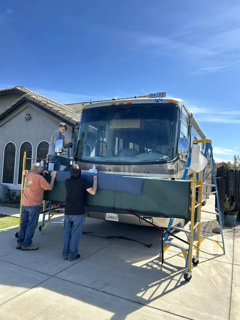 On-site RV windshield installation outside a home