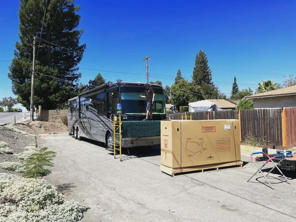 New replacement windshield in its crate at a motorhome job