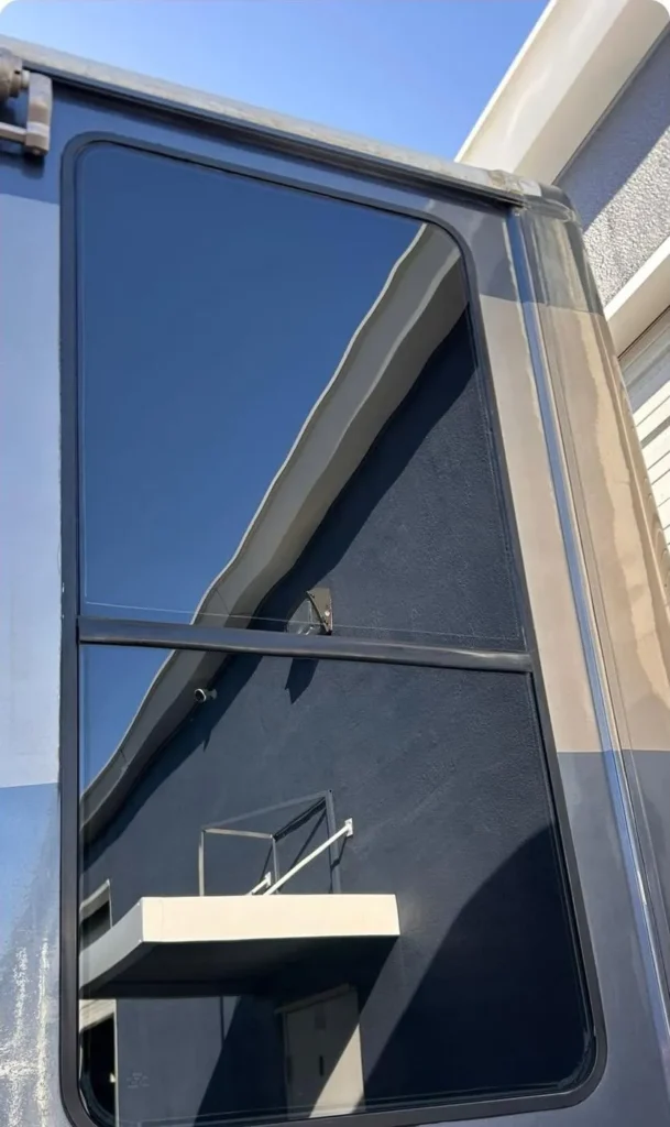 The same RV side window after replacement, clear again