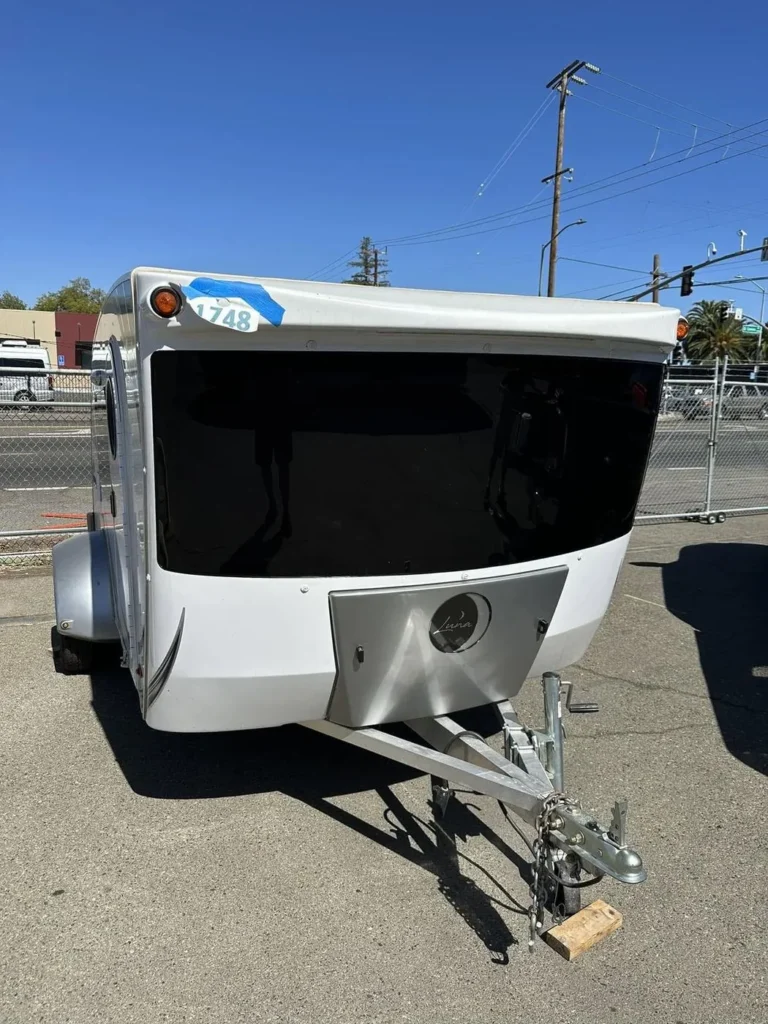 The same travel trailer with its new front window installed